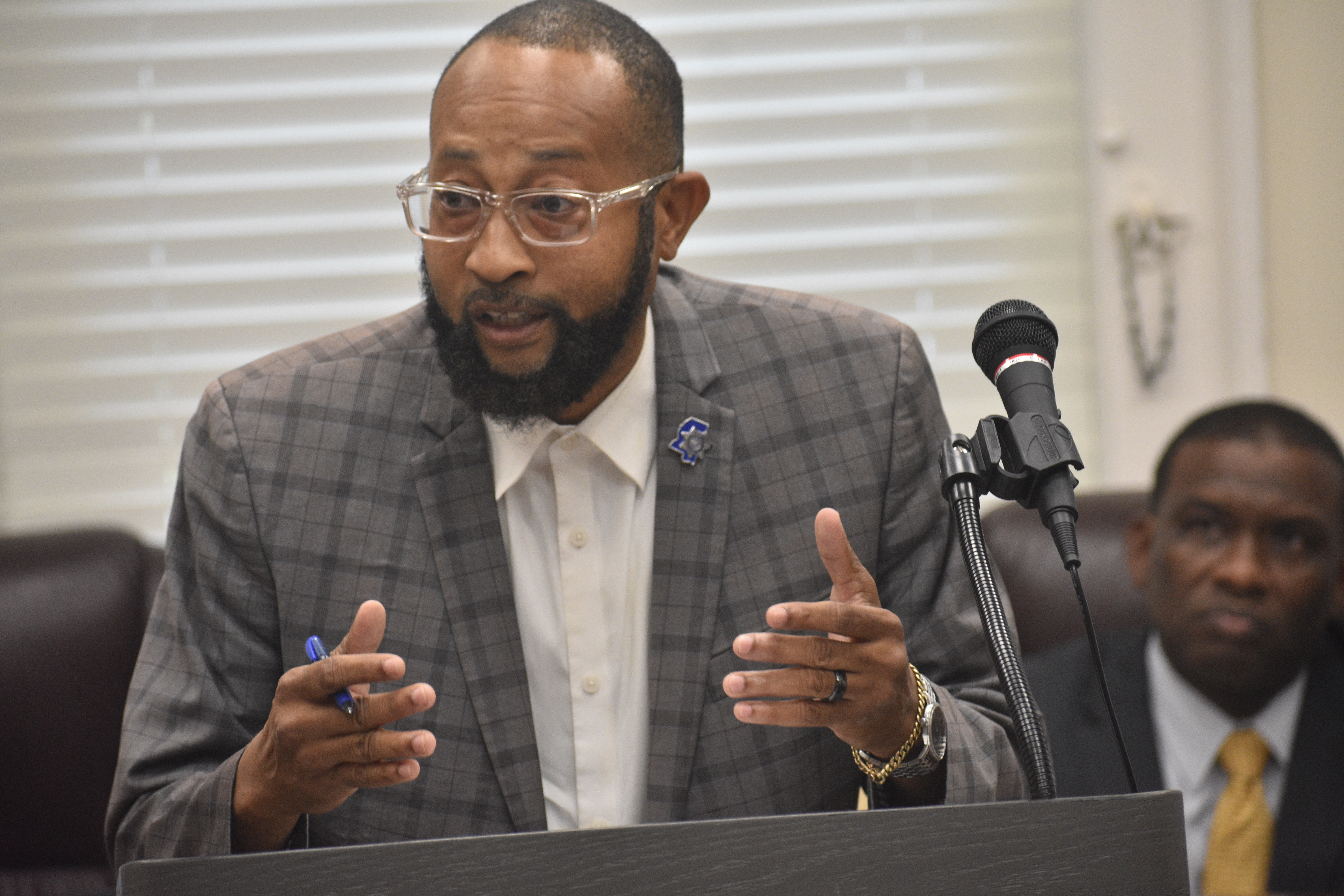 Reginald Moore addresses the audience 