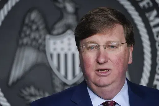 Mississippi Republican Gov. Tate Reeves speaks during a news conference on Feb. 28, 2023, in Jackson, Miss. Reeves signed a bill Tuesday, March 14, 2023, that will restrict electric car manufacturers from opening dealerships in the state unless they work with a franchisee, defying calls to veto the legislation from some lawmakers in his party. (AP Photo/Rogelio V. Solis, File)