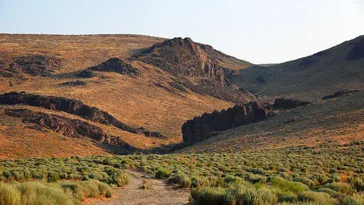 The Montana Mountains loom over Thacker Pass in northern Nevada on July 14, 2021. The new lithium mining project closest to development is the one proposed for Thacker Pass by Lithium Americas. That northern Nevada mine would make millions of tons of lithium available, but Native American tribes have argued that it's located on sacred lands and should be stopped. (Jason Bean/The Reno Gazette-Journal via AP, File)