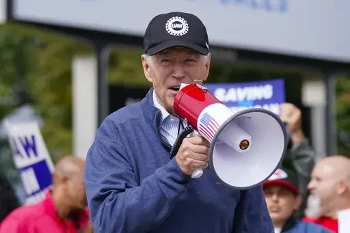 President Joe Biden joins striking United Auto Workers on the picket line, Sept. 26, 2023, in Van Buren Township, Mich. (AP Photo/Evan Vucci, File)