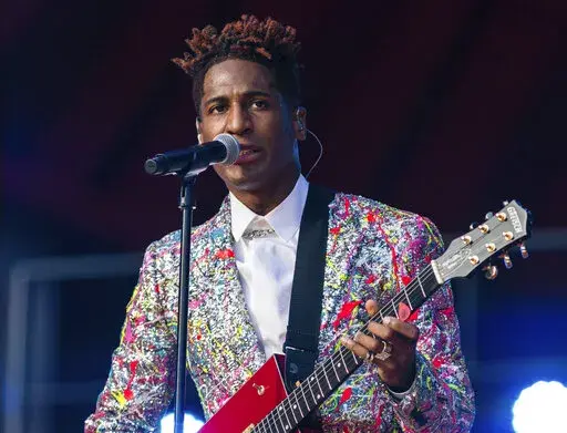 FILE - Jon Batiste performs during the Global Citizen festival on Sept. 25, 2021 in New York. Batiste received 11 Grammy Award nominations, including ones for album of the year, record of the year, and best R&B album. (AP Photo/Stefan Jeremiah, File)