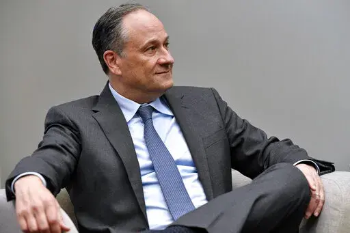 Second gentleman Doug Emhoff listens as he meet with women entrepreneurs for a panel discussion while visiting Mi Casa Resource Center in Denver, on March 11, 2022. The White House says Emhoff has tested positive for COVID-19. Vice President Kamala Harris tested negative, but is curtailing her schedule as a result of her husband’s positive test. (Jason Connolly/Pool via AP)