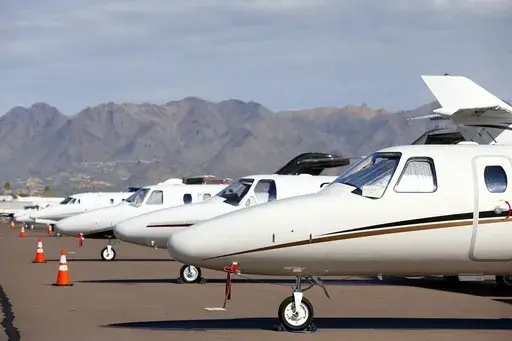 Private jets sit parked at Scottsdale Airport on Jan. 27, 2015, in Scottsdale, Ariz. (AP Photo/Ross D. Franklin, File)