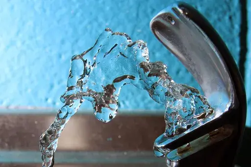 Water flows from a water fountain in Concord, N.H., on Friday, Jan. 7, 2011. (AP Photo/Jim Cole, File)