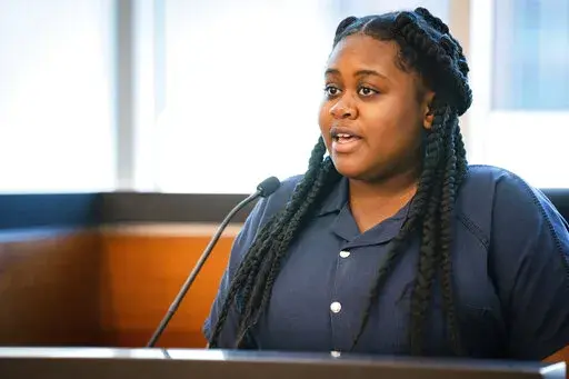 Pieper Lewis gives her allocution during a sentencing hearing, Tuesday, Sept. 13, 2022, in Des Moines, Iowa. Lewis, who was initially charged with first-degree murder after she stabbed her accused rapist to death in June 2020, was sentenced to five years of closely supervised probation and ordered to pay $150,000 restitution to the man’s family. (Zach Boyden-Holmes/The Des Moines Register via AP)