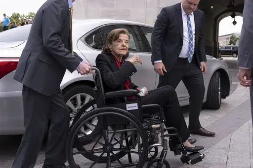 Sen. Dianne Feinstein, D-Calif., is assisted to a wheelchair by staff as she returns to the Senate after a more than two-month absence, at the Capitol in Washington, Wednesday, May 10, 2023. Feinstein’s office said Thursday, May 18, that she is suffering from Ramsay Hunt syndrome, a complication from the shingles virus that can paralyze part of the face, and that she contracted encephalitis while recovering from the virus earlier this year. (AP Photo/J. Scott Applewhite, File)