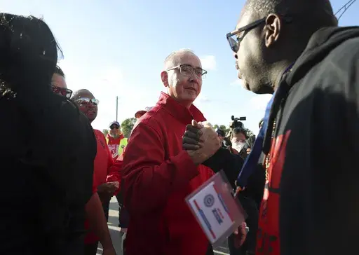 United Auto Workers President Shawn Fain, center, visits striking UAW Local 551 workers outside a Ford assembly center on South Burley Avenue on Oct. 7, 2023, in Chicago. Throughout its 5-week-old strikes against Detroit’s automakers, the United Auto Workers union has cast an emphatically combative stance, reflecting the style of Fain, its pugnacious leader. (John J. Kim /Chicago Tribune via AP, File)