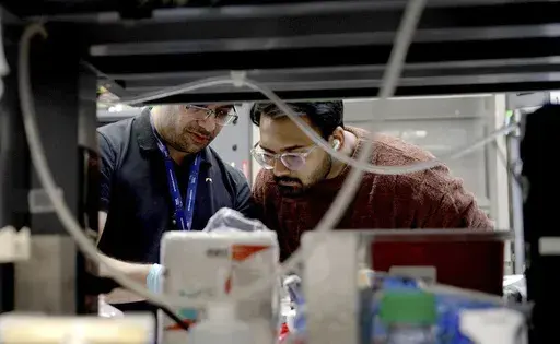 Lab workers at Johns Hopkins University work in Richard Huganir's lab in Baltimore, Md., on Feb. 26, 2025. (AP Photo/Shelby Lum)