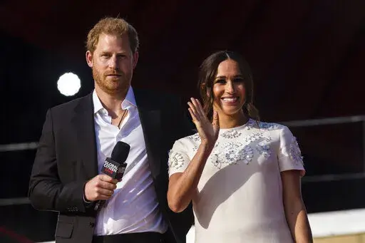Prince Harry and his wife Meghan speak during the Global Citizen festival, on Sept. 25, 2021 in New York. Prince Harry and his wife Meghan have visited Queen Elizabeth II at Windsor Castle on their first joint visit to the U.K. since they gave up formal royal roles and moved to the U.S. more than two years ago. The couple’s office says they visited the 95-year-old queen, Harry’s grandmother, Thursday, April 14, 2022 on their way to the Netherlands to attend the Invictus Games (AP Photo/Stefa