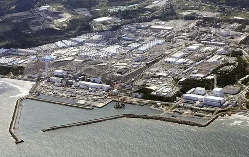 This aerial view shows the Fukushima Daiichi nuclear power plant, situated in coastal towns of both Okuma and Futaba, northeastern Japan, on Aug. 24, 2023, shortly after its operator Tokyo Electric Power Company Holdings TEPCO began releasing its first batch of treated radioactive water into the Pacific Ocean. Japan said Sunday, March 31, 2024, its experts have held talks with their Chinese counterparts to try to assuage Beijing’s concerns over the discharge of treated radioactive wastewater f