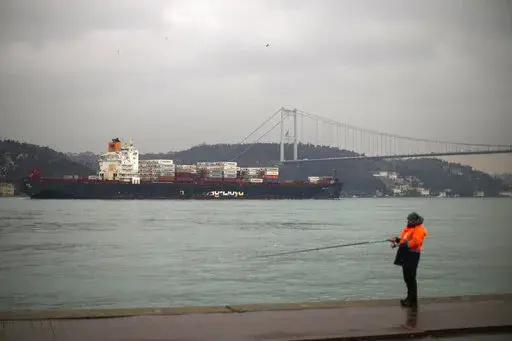 Cargo ship Oakland crosses the Bosphorus strait towards the Marmara sea after departing from Russia's Novorossiysk port, in Istanbul, Tuesday, March 1, 2022. Turkey, which is trying to balance its support for Ukraine with its fragile economic ties to Russia, said Monday it is implementing an international convention that allows the country to shut down the straits at the entrance of the Black Sea to warships, to avoid an escalation of the conflict. (AP Photo/Francisco Seco, File)