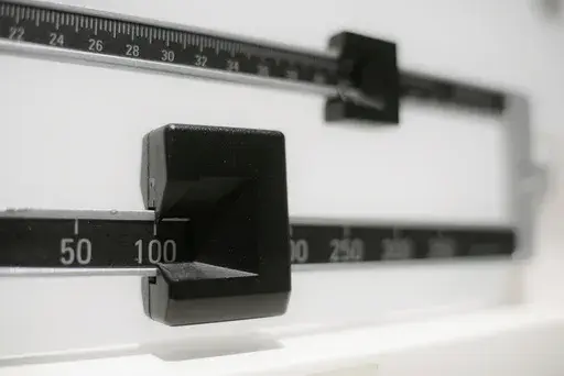 This Tuesday, April 3, 2018 file photo shows a closeup of a beam scale in New York. The Food and Drug Administration is warning consumers, Thursday, June 1, 2023, not to use off-brand versions of the popular weight-loss drugs Ozempic and Wegovy sold online because they might not contain the same ingredients as the prescription products and may not be safe or effective. (AP Photo/Patrick Sison, File)