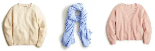 This combination of photos shows a ribbed cashmere crewneck sweater, left, a cashmere wrap, center, and ribbed cashmere V-neck sweater from J.Crew. (J.Crew via AP)