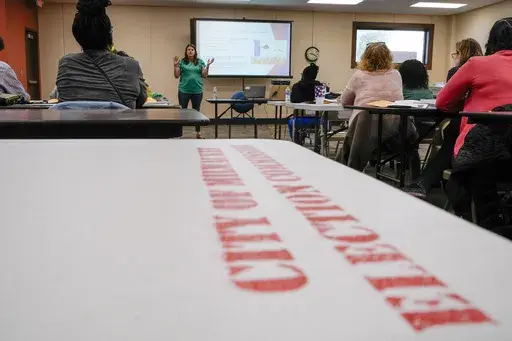 Claire Woodall executive director of the City of Milwaukee Election Commission, teaches a class to poll workers Saturday, Oct. 22, 2022, in Milwaukee. On Friday, May 17, 2024 The Associated Press reported on stories circulating online incorrectly claiming the Milwaukee Election Commission Executive Director was fired in recent days for her role in rigging the 2020 presidential election.(AP Photo/Morry Gash, File)