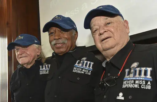 Members of the Never Miss a Super Bowl Club, from the left, Tom Henschel, Gregory Eaton, and Don Crisman pose for a group photograph during a welcome luncheon, in Atlanta, Friday, Feb. 1, 2019. As long as they still have each other, they're still going to go to every Super Bowl. That's the sentiment shared by the three friends who say they are the final fans who can claim membership in the exclusive “never missed a Super Bowl” club. And they're back again for number 58 — Super Bowl 58 — 
