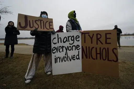 A group of demonstrators gather at dusk in Shelby Farms Park on Monday, Jan. 30, 2023, in Memphis, Tenn., in response to the death of Tyre Nichols, who died after being beaten by Memphis police officers. Nichols, who had a hobby in photography, frequented the park to photograph sunsets. (AP Photo/Gerald Herbert)