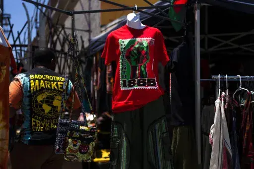 A Juneteenth T-shirt is for sale in Los Angeles, Friday, June 17, 2022. Retailers and marketers from Walmart to Amazon have been quick to commemorate Juneteenth with an avalanche of merchandise from ice cream to T-shirts to party favors. (AP Photo/Jae C. Hong)