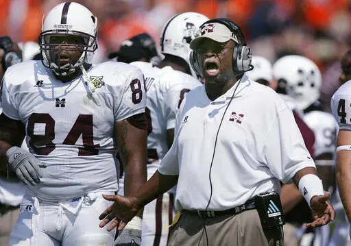 Mississippi State coach Sylvester Croom yells to the team near the end of a 19-14 win over Auburn in an NCAA college football game at Jordan-Hare Stadium in Auburn, Ala., Sept. 15, 2007. Croom had a Hall of Fame career as an offensive lineman at Alabama, and was among the first Black players to become a star and team leader under coach Bear Bryant. Three decades later, Croom became the Southeastern Conference's first Black head football coach with Mississippi State. That was 2004. Since then, th