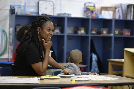 Teacher Vanessa Simmons works with children at a Head Start program at Alliance for Community Empowerment, Thursday, Sept. 28, 2023, in Bridgeport, Conn. Head Start programs serving more than 10,000 disadvantaged children would immediately lose federal funding if there is a federal shutdown, although they might be able to stave off immediate closure if it doesn't last long. (AP Photo/Jessica Hill)