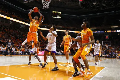 Tennessee forward Julian Phillips (2) shoots past Alcorn State forward Darryl Jordan (20) during the first half of an NCAA college basketball game Sunday, Dec. 4, 2022, in Knoxville, Tenn. (AP Photo/Wade Payne)