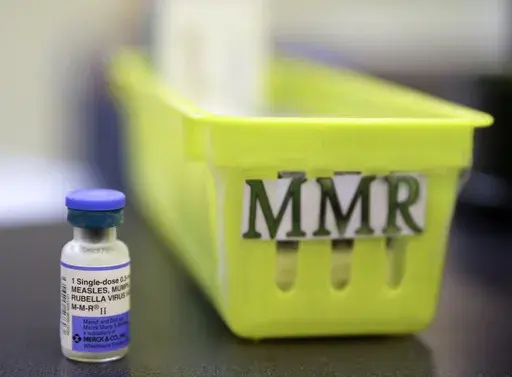A vial of a measles, mumps and rubella vaccine sits on a countertop at a pediatrics clinic in Greenbrae, Calif., on Feb. 6, 2015. (AP Photo/Eric Risberg, File)