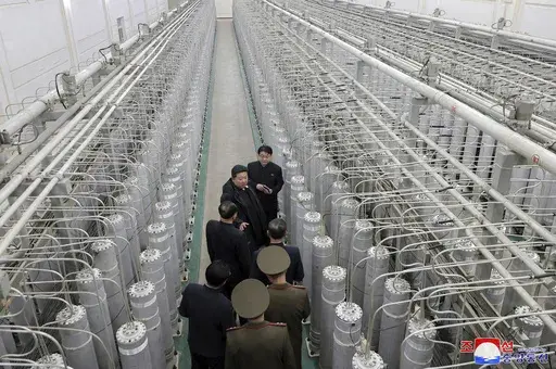 In this undated photo provided Wednesday, Jan. 29, 2025, by the North Korean government, its leader Kim Jong Un, second from top, inspects a facility that produces nuclear material at an undisclosed location in North Korea. Independent journalists were not given access to cover the event depicted in this image distributed by the North Korean government. The content of this image is as provided and cannot be independently verified. Korean language watermark on image as provided by source reads: "