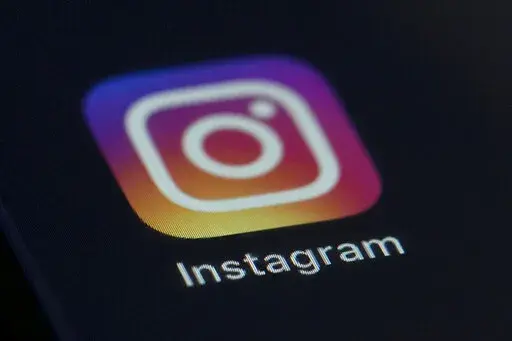 This photo shows the Instagram app icon on the screen of a mobile device on Aug. 23, 2019. Russian regulators said Friday, March 11, 2022, that internet users in the country will be blocked from accessing Instagram because it's being used to call for violence against Russian soldiers, in Moscow's latest move to tighten up access to foreign social platforms. (AP Photo/Jenny Kane, File)