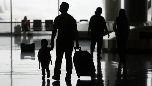 People travel through Salt Lake City International Airport on Wednesday, Feb. 22, 2023, in Salt Lake City. All-inclusive vacations can sometimes get a bad rap for being generic, inauthentic and filled with mediocre food and activities. But by booking the right kind of all-inclusive (which often means those that limit guest counts to only a couple dozen), you can find a unique vacation with personal attention. (AP Photo/Rick Bowmer, File)