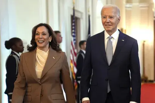 Vice President Kamala Harris, left, and President Joe Biden arrive for an event in the East Room of the White House, May 9, 2024, in Washington. She's already broken barriers, and now Harris could soon become the first Black woman to head a major party's presidential ticket after President Joe Biden's ended his reelection bid. The 59-year-old Harris was endorsed by Biden on Sunday, July 21, after he stepped aside amid widespread concerns about the viability of his candidacy. (AP Photo/Evan Vucci