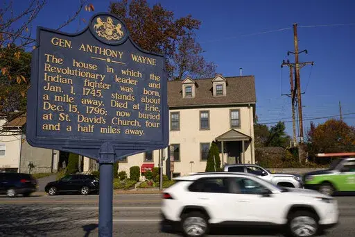 Shown is a Pennsylvania Historical Marker for Revolutionary War Gen. Anthony Wayne in Paoli, Pa., Thursday, Nov. 18, 2021. A recent review of all 2,500 markers the Pennsylvania Historical and Museum Commission had been installing for more than a century, faced a fresh round of questions about just whose stories were being told on the state's roadsides, and the language used to tell them. The increased scrutiny that has focused on factual errors, inadequate historical context and racist or otherw