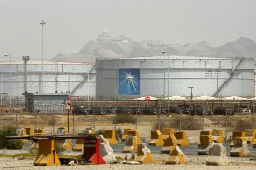 Storage tanks are seen at the North Jiddah bulk plant, an Aramco oil facility, in Jiddah, Saudi Arabia, on March 21, 2021. Saudi Arabia said Thursday, Aug. 3, 2023, it will extend its unilateral production cut of 1 million barrels of oil a day through the end of September in its effort to boost flagging energy prices. (AP Photo/Amr Nabil, File)