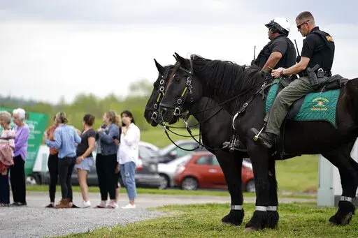 FILE -Officers on horseback guard the entrance to designated demonstrator areas near Riverbend Maximum Security Institution as people wait to enter before the scheduled execution of inmate Oscar Smith, Thursday, April 21, 2022, in Nashville, Tenn. Newly released records show at two least two people connected to a planned Tennessee execution that was abruptly put on hold April 21 knew the night before that the lethal injection drugs the state planned to use hadn’t undergone certain required tes