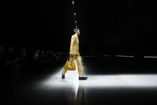 A model wears a creation as part of the men's Gucci Fall-Winter 2024-2025 collection, that was presented in Milan, Italy, Friday, Jan. 12, 2024. (AP Photo/Luca Bruno).