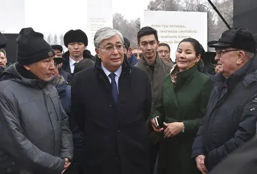 Kazakhstan President Kassym-Jomart Tokayev speaks in Almaty, Kazakhstan, on Friday, Dec. 23, 2022, at an unveiling of a memorial to those killed in January 2022 in the worst unrest in the Central Asian country’s three decades of independence. The photo was released by his Presidential Press Service. Words on the memorial speak of the need for unity and harmony in the former Soviet country of 19 million, but a year after calm was restored and a state of emergency lifted on Jan. 20, 2022, both a
