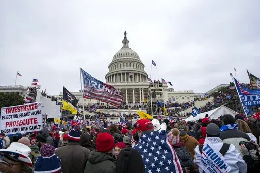 Rioters loyal to President Donald Trump rally at the U.S. Capitol in Washington on Jan. 6, 2021. Federal prosecutors say Taylor Taranto, 37, who prosecutors say participated in the Jan. 6, 2021 riot at the U.S. Capitol and arrested last week near the home of former President Barack Obama, told followers on his YouTube live stream that he was looking to get a “good angle on a shot” and that he was trying to locate the “tunnels underneath their houses” shortly before he was taken into cust