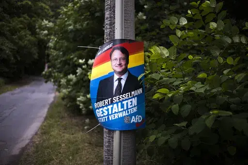 A election campaign poster of far-right AfD candidate Robert Sesselmann remains at a street at the outskirts of the small city Sonneberg at the German federal state Thuringia, Wednesday, July 5, 2023. The Alternative for Germany, or AfD, candidate Robert Sesselmann won the runoff election for a local county administrator in Sonneberg county on June 25, 2023. Sonneberg has a relatively small population of 56,800, but the win is a symbolic milestone for the far-right populist party AfD.(AP Photo/M