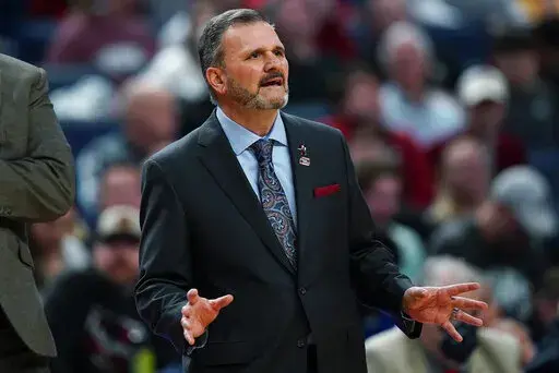 New Mexico State coach Chris Jans watches during the first half of the team's college basketball game against Arkansas in the second round of the NCAA men's tournament Saturday, March 19, 2022, in Buffalo, N.Y. (AP Photo/Frank Franklin II)