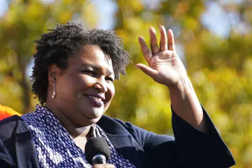 FILE - In this Monday, Nov. 2, 2020, file photo, Stacey Abrams speaks to Biden supporters as they wait for former President Barack Obama to arrive and speak at a campaign rally for Biden at Turner Field in Atlanta. (AP Photo/Brynn Anderson, File)