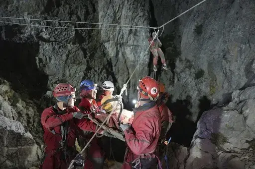 In this photo released by Turkish government's Search and Rescue agency AFAD, American researcher Mark Dickey, center, is pulled out of Morca cave near Anamur, south Turkey, on early Tuesday, Sept. 12, 2023, more than a week after he became seriously ill 1,000 meters (more than 3,000 feet) below its entrance. Teams from across Europe had rushed to Morca cave in southern Turkey's Taurus Mountains to aid Dickey, a 40-year-old experienced caver who became seriously ill on Sept. 2 with stomach bleed