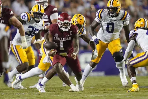 Arkansas quarterback KJ Jefferson (1) fumbles in the second half of an NCAA college football game against LSU in Baton Rouge, La., Saturday, Sept. 23, 2023. LSU won 34-31. (AP Photo/Gerald Herbert)