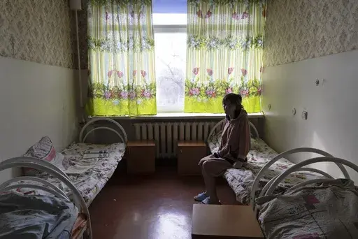Natalia, 37, a patient, sits in her room at a psychiatric hospital in Kramatorsk, Ukraine, Tuesday March 21, 2023. In December, the World Health Organization said one in five people in countries that have experienced conflict in the past decade will suffer from a mental health condition, and estimated that about 9.6 million people in Ukraine could be affected. Russia’s invasion in February 2022 resulted in millions of people being displaced, bereaved, forced into basements for months due to in