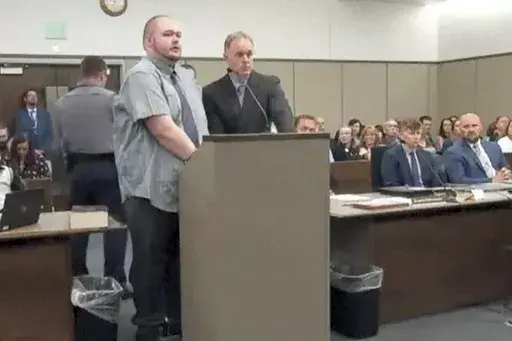In this image taken from video provided by the Colorado Judicial Branch, Anderson Lee Aldrich, left, the suspect in a mass shooting that killed five people at a Colorado Springs LGBTQ+ nightclub in 2022, appears in court, June 26, 2023, in Colorado Springs, Colo., where they pleaded guilty in the attack. Aldrich was charged with federal hate crimes on Tuesday, Jan. 16, 2024. (Colorado Judicial Branch via AP, File)