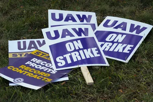 United Auto Workers signs for a strike are shown at the Stellantis Sterling Heights Assembly Plant, in Sterling Heights, Mich., Monday, Oct. 23, 2023. Jeep maker Stellantis has reached a tentative contract agreement with the United Auto Workers union that follows a template set earlier this week by Ford, two people with knowledge of the negotiations said Saturday, Oct. 28, 2023. (AP Photo/Paul Sancya, File)