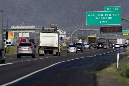 Traffic moves along the notoriously congested stretch of I-10 through tribal land called the Wild Horse Pass Corridor, Wednesday, Jan. 25, 2023 in Chandler, Ariz. With the Gila River Indian Community's backing, Arizona allocated or raised about $600 million of a nearly $1 billion plan that would widen the most bottleneck-inducing, 26-mile section of I-10 on the route between Phoenix and Tucson. But its request for federal money to finish the job fell short — a victim of the highly competitive 