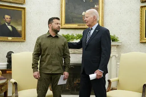 President Joe Biden meets with Ukrainian President Volodymyr Zelenskyy in the Oval Office of the White House, Sept. 21, 2023, in Washington. The White House says Biden has been in touch with U.S. allies and partners to discuss continued support for Ukraine in its fight against Russia. Tuesday's conversation came after Biden signed legislation late Saturday to keep the U.S. government funded. (AP Photo/Evan Vucci, File)