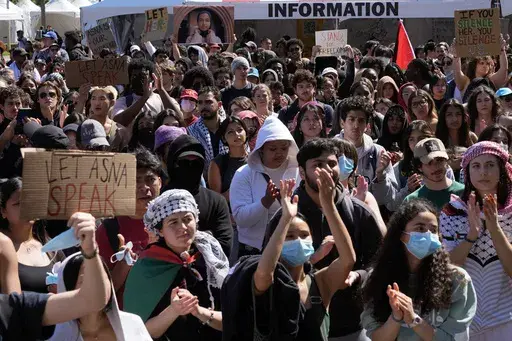 Students protest a canceled commencement speech by its 2024 valedictorian who has publicly supported Palestinians on the campus of University of Southern California on Thursday, April 18, 2024. U.S. colleges and universities are preparing for end-of-year commencement ceremonies with a unique challenge: providing safety for graduates while honoring the free speech rights of students involved in protests over the Israel-Hamas war. (AP Photo/Damian Dovarganes, File)
