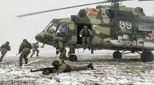 In this photo taken from video and released by the Russian Defense Ministry Press Service on Friday, Feb. 4, 2022, soldiers take part in joint drills between Belarus and Russia at Brestsky firing range in Belarus. Belarus President Alexander Lukashenko has welcomed thousands of Russian troops to his country, allowed the Kremlin to use it to launch the invasion of Ukraine on Feb. 24, 2022, and offered to station some of Moscow’s tactical nuclear weapons there. But he has avoided having Belarus 