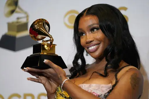 SZA, winner of the award for best pop duo/group performance for "Kiss Me More," poses in the press room at the 64th Annual Grammy Awards on April 3, 2022, in Las Vegas. SZA received nine Grammy nominations on Friday. (AP Photo/John Locher, File)