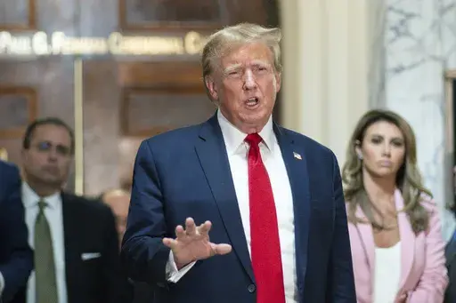 Former President Donald Trump speaks after exiting the courtroom for a break at New York Supreme Court, Dec. 7, 2023, in New York. Lawyers for Trump say he may testify at a mid-January trial set to decide how much he owes columnist E. Jean Carroll for defaming her after she said he sexually abused her three decades ago in a Manhattan department store. The lawyers filed papers in Manhattan federal court late Thursday, Dec. 29, 2023, to request that Trump's October 2022 deposition transcript in th
