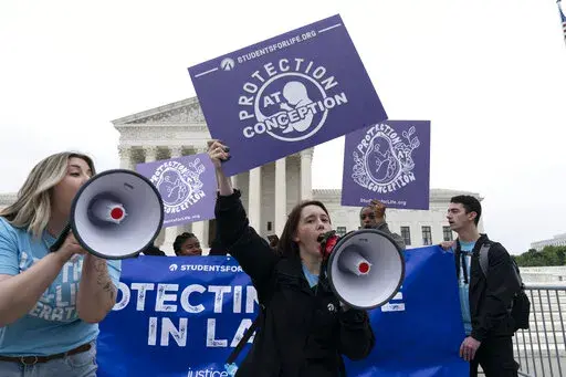 Demonstrators protest outside of the U.S. Supreme Court Tuesday, May 3, 2022 in Washington. A draft opinion suggests the U.S. Supreme Court could be poised to overturn the landmark 1973 Roe v. Wade case that legalized abortion nationwide, according to a Politico report released Monday. Whatever the outcome, the Politico report represents an extremely rare breach of the court's secretive deliberation process, and on a case of surpassing importance. (AP Photo/Jose Luis Magana)